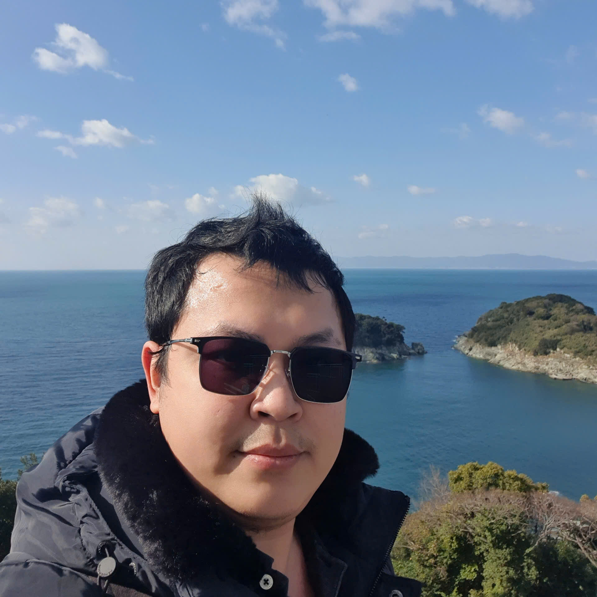 Alex Ngo portrait by the sea